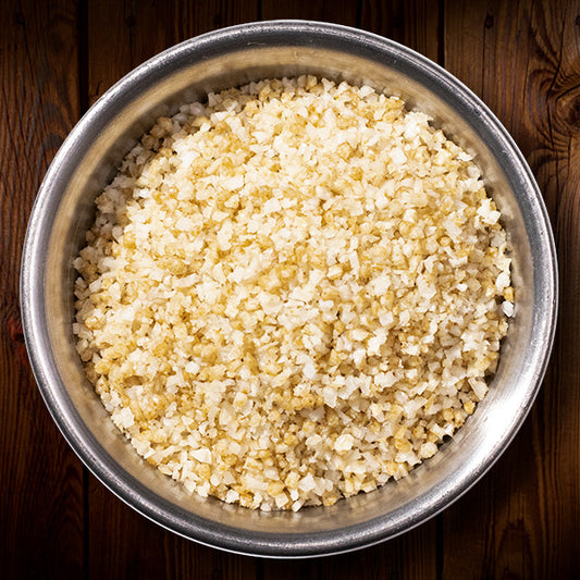 Jalapeno flavored finishing flake salt in a circular metal container