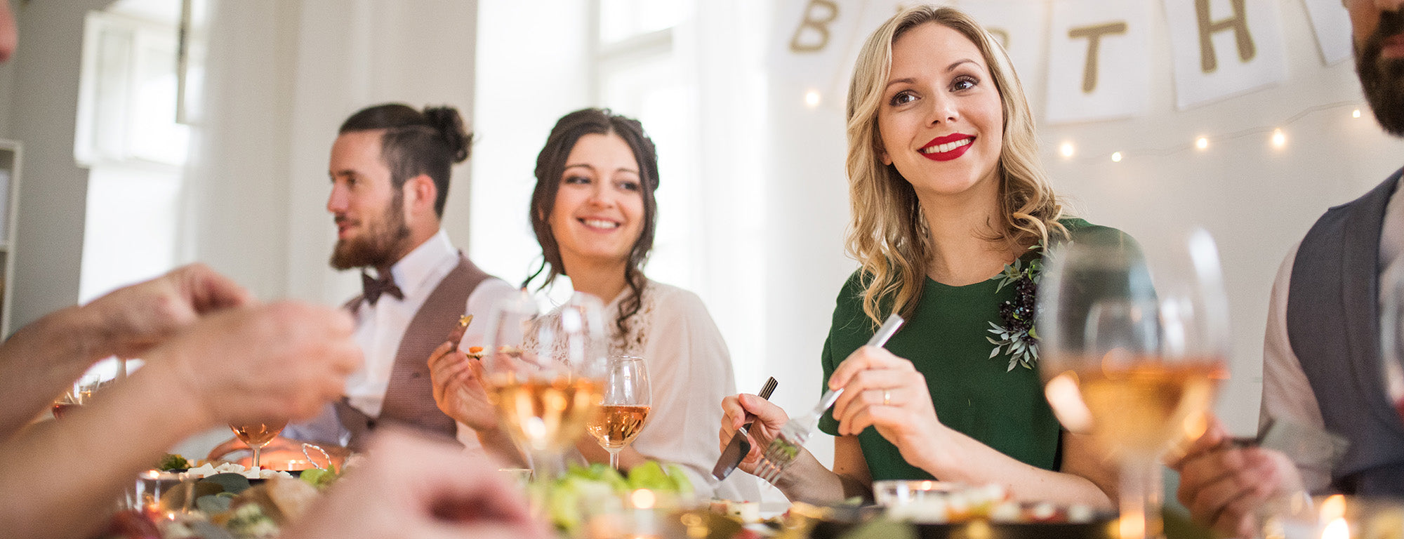 A birthday celebration with Millenials at a table