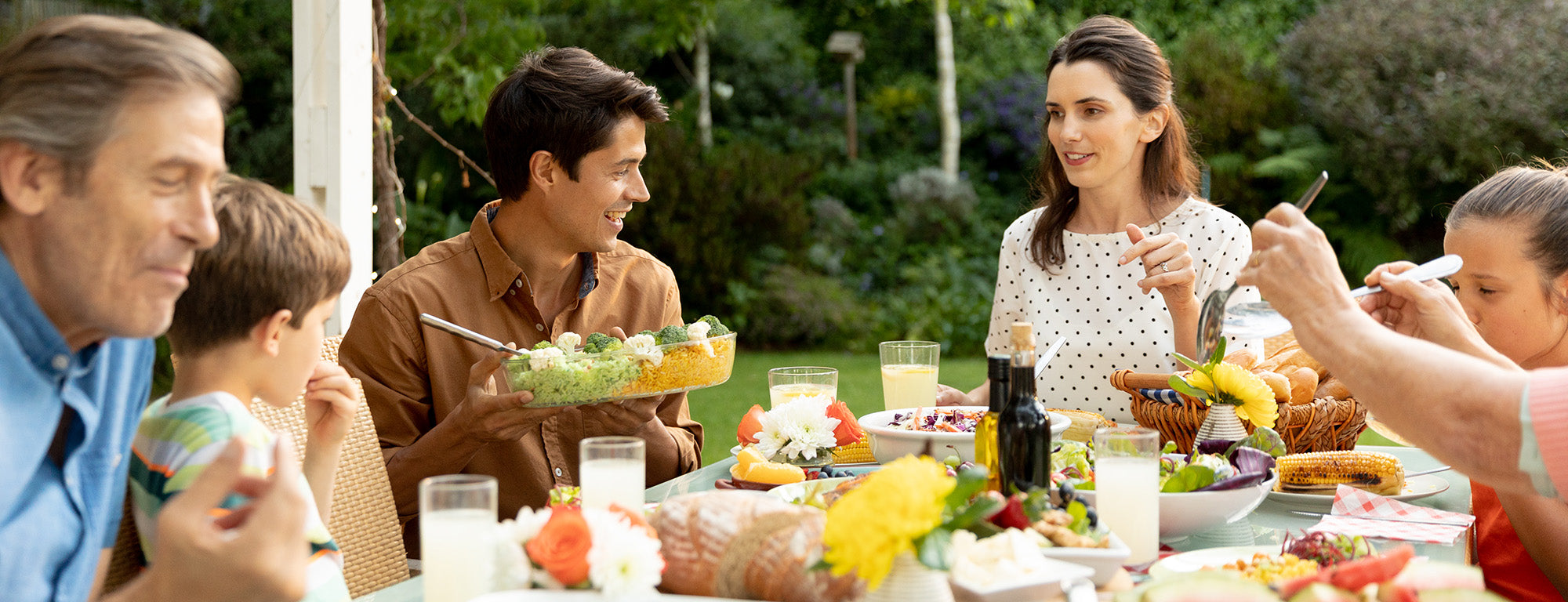 Family eating together outdoors