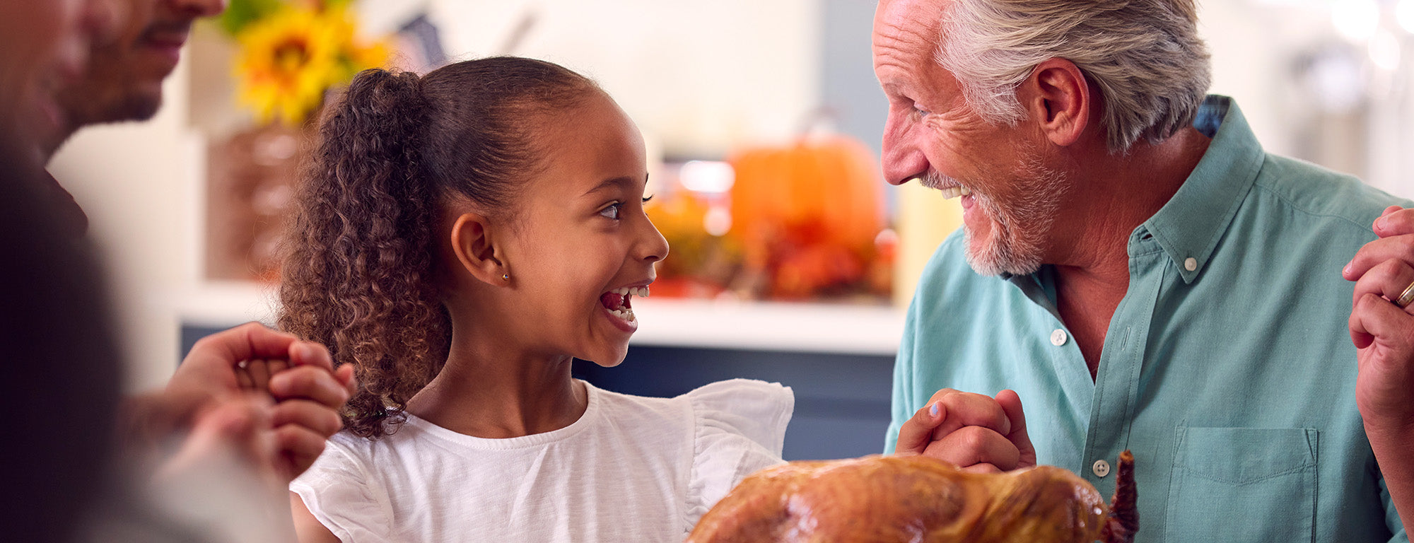 Grandfather and granddaughter having a special moment over a meal