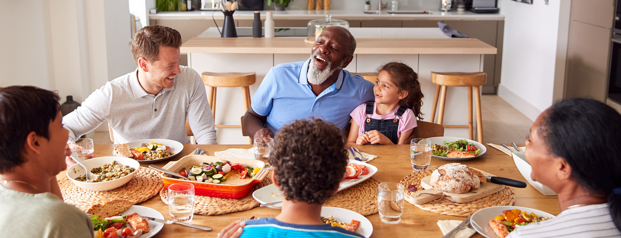 Multi generational family eating a meal together