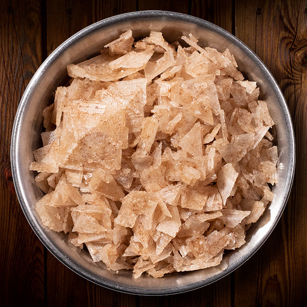 Applewood Smoked Pyramid Salt in a circular metal container